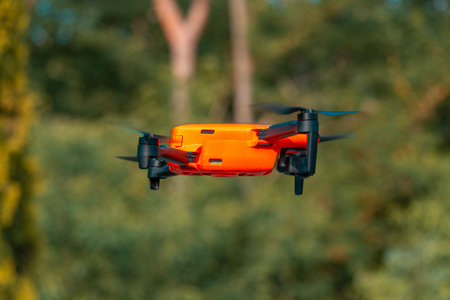 Drone quadcopter with digital camera flying in the air.の写真素材