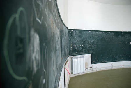 Blackboard in a run-down school, concept of education in crisisの写真素材