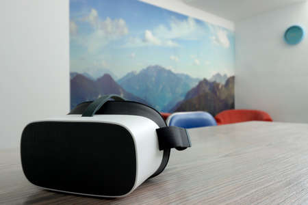 Photo of a virtual reality glasses, augmented reality isolated on a table
