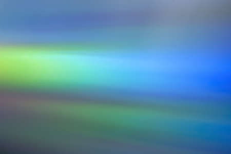 Iridescent and colorful texture wallpaper of an old cd-rom
