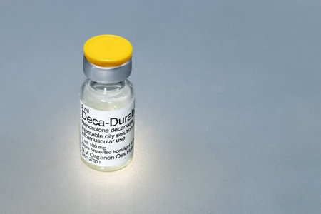 Spain, Madrid, 01-13-2022, A vial of liquid substance to be injected, an anabolic steroid called nandrolone decanoate on a gray backgroundのeditorial素材