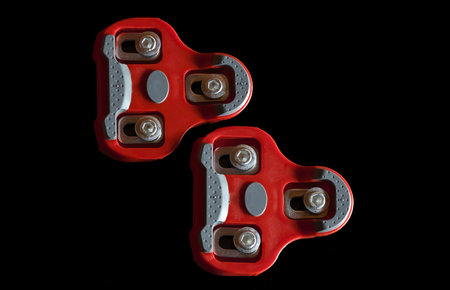 Close-Up of Red Bicycle Cleats on Black Background