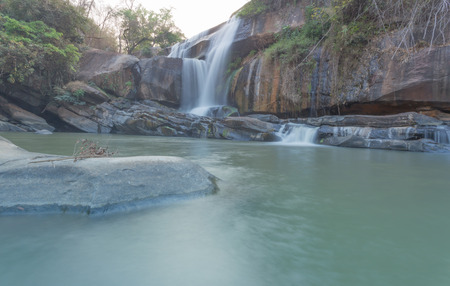 Water fall in spring season located in deep rain forest jungleの写真素材