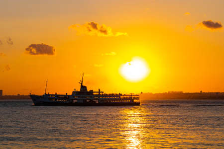 Sunset and ferry in Istanbulの写真素材