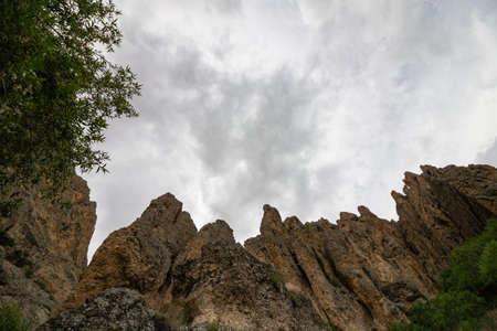 Hills in a canyon with cloudy sky