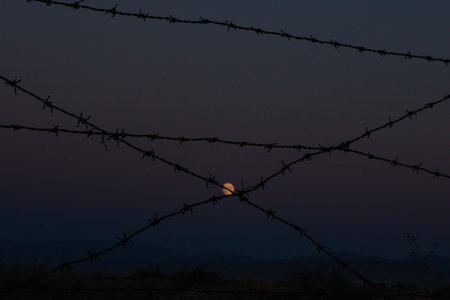 The Moon and Barbed Wireの写真素材