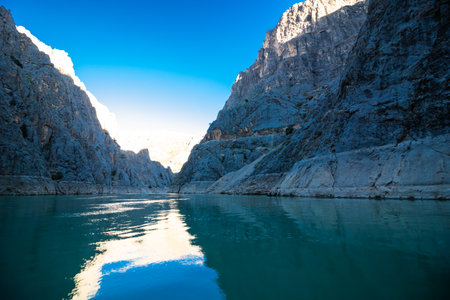 Boat tour on the river in the canyon. Reflections of the cliffs over the river. Landscape of the canyon from below.の素材 [FY310161084984]