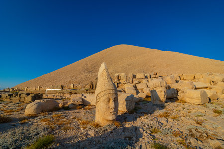 Western Terrace of Mount Nemrut at sunset. Statues of King Antiochus I of Commagene and gods. Ruins of the statues of Commagene Kingdom. Adiyaman Turkey.の写真素材