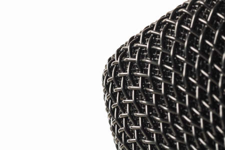 Close up photo of the microphone. Radio and podcast background photo. Macrophoto of the microphone with copy space.の写真素材