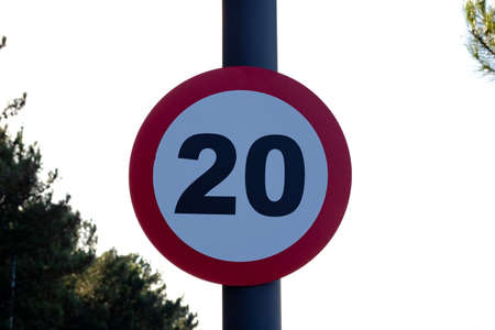 Speed limit sign. 20 kph or mph speed limit sign with red circle. Speed limit background photo.