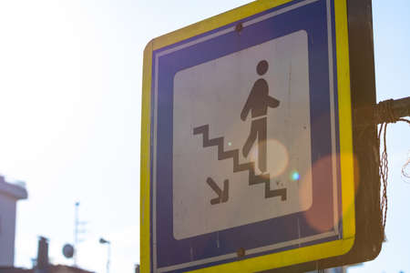 Underpass sign with lens flare. Pedestrian signs in the city. No car zone.の写真素材