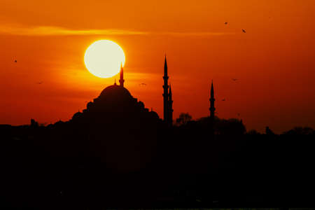 Silhouette of Suleymaniye Mosque at Sunset. Ramadan, oil lamp and iftar background photo. Islamic photos. Mosques of Istanbul.の写真素材