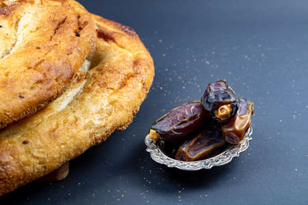 Traditional Ramadan Pita and dates. Iftar foods. Ramadan fast. Ramadan and iftar background photo. Traditional Turkish ramadan foods Ramadan pita.の写真素材