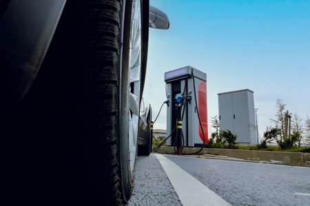 EV car plugged in charger and EV Charger station