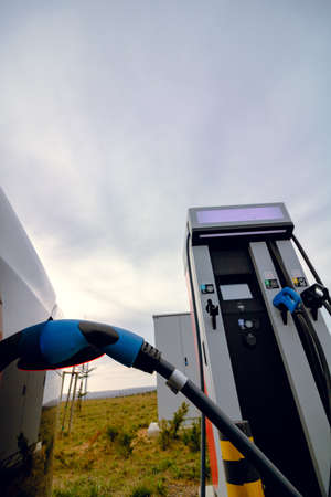 EV car plugged in charger and EV Charger station