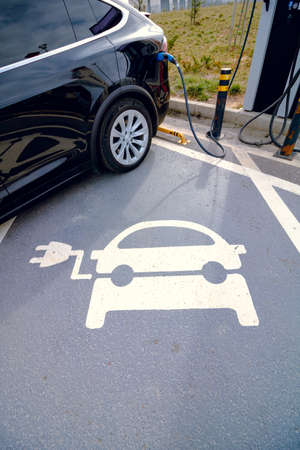 EV car plugged in charger and EV Charger station