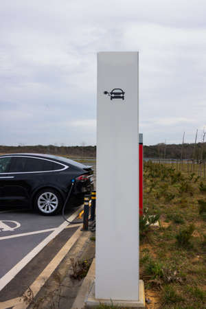 EV charging station with an electric vehicle