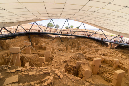 Sanliurfa Turkey - 8.16.2021: Gobeklitepe archaeological site in Sanliurfa. Excavation site of Gobeklitepe. Starting point in history. Temple ruins in Gobeklitepe.のeditorial素材
