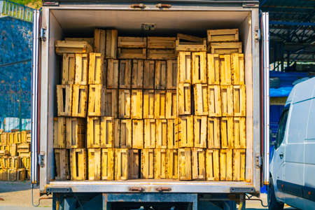 Wooden box stack. Wooden box stack in the truck in a fishing harbor. Fishing industry background...