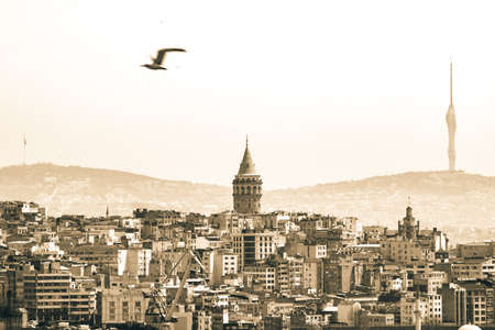 Galata Tower. Galata Tower and Beyoglu district with Camlica Hills on background. Monochrome Istanbul background photo.の写真素材