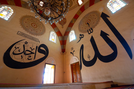 Islamic background photo. Calligraphies in the Edirne Old Mosque. Texts of Name of Allah and The One on the walls. Ramadan or kandil or laylat al-qadr or islamic background. Edirne Turkey - 10.25.2021のeditorial素材