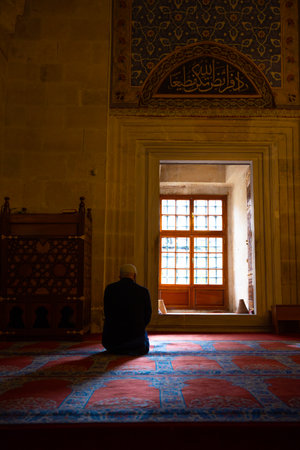 Islamic story background photo. Muslim man waiting a salat or pray in a mosque. Ramadan or fasting or kandil or laylat al-qadr or islamic story background photo. Edirne Turkey - 10.25.2021のeditorial素材