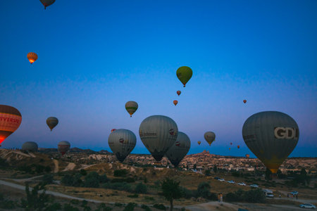 Cappadocia balloons at sunrise. Travel to cappadocia background photoのeditorial素材