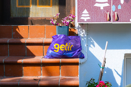 Bag of Getir in front of the door of a house. Getir Company. Istanbul Turkey - 9.14.2021