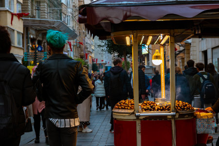 Raosted chestnuts on the cart in Istiklal Avenue in Istanbul. Turkish street foods. Istanbul Turkey - 12.28.2021のeditorial素材