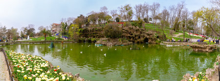 Panoramic view of Emirgan Park or Emirgan Grove with pond and tulips and tourists in Sariyer Istanbul. Istanbul Turkey - 4.16.2022のeditorial素材