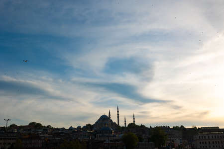 Silhouette of Suleymaniye Mosque and Istanbul at sunset with cloudy sky. Travel to Istanbul background photo with copy space.の写真素材