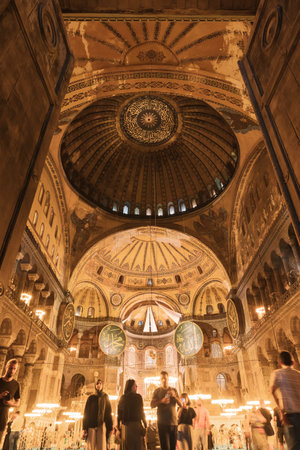 Hagia Sophia or Ayasofya with tourists in wide angle view. Travel to Istanbul background photo....