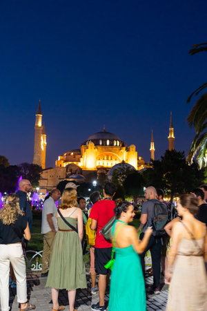 Travel to Istanbul photo. Tourists taking photos of Hagia Sophia from Sultanahmet Square. Selective focus. Noise included. Istanbul Turkey - 8.12.2022のeditorial素材