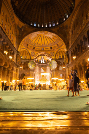 Interior of Hagia Sophia or Ayasofya Mosque. Tourists in Hagia sophia. Travel to Istanbul background vertical photo. Istanbul Turkey - 8.12.2022のeditorial素材