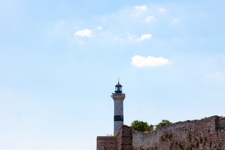 Lighthouse at daytime with partly cloudy sky. Ahirkapi lighthouse in Istanbul. Maritime background photo with copy space for text.の写真素材