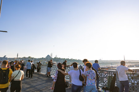 Tourists walking on the Galata Bridge. Travel to Istanbul background photo. Istanbul Turkey - 8.20.2022のeditorial素材