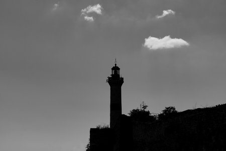 Silhouette of a lighthouse. Monochrome view of a lighthouse. Creepy or horrific or scary concept photo.の写真素材