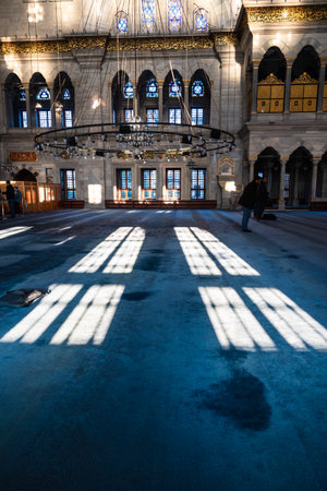 Shadows of the windows on the carpet in Nuruosmaniye Mosque. Islamic background vertical photo. Istanbul Turkiye - 12.23.2022のeditorial素材