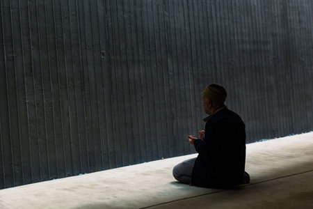 Praying muslim man in a modern mosque. Ramadan or islamic background photo. Istanbul Turkiye -...