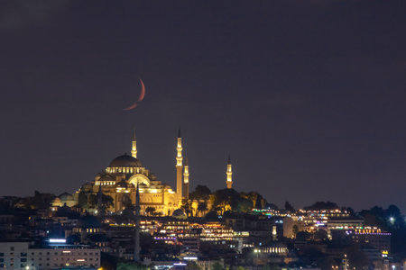 Ramadan or islamic photo. Suleymaniye Mosque with crescent moon. Kandil or laylat al-qadr concept. Noise included. Selective focus.の写真素材