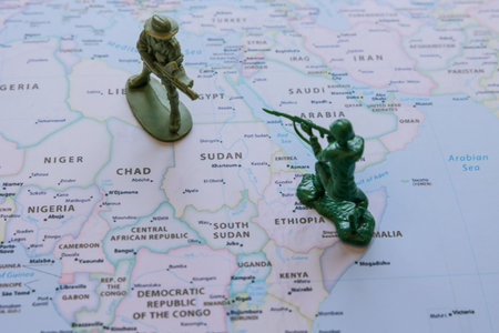 Sudanese and Ethiopian conflict concept photo. Warfare between Sudan and Ethiopia because of...