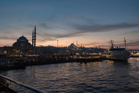 Istanbul view at sunset. Ferry and famous mosques in Eminonu district of Istanbul. Istanbul Turkiye - 12.24.2022のeditorial素材