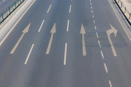 Highway with directional arrows. Transportation background photo. 4 lane highway.