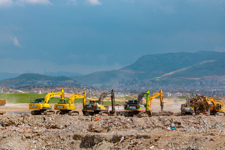 excavators on the rubble landfill area in Malatya after the major earthquakes. Malatya Turkiye - 4.24.2023のeditorial素材