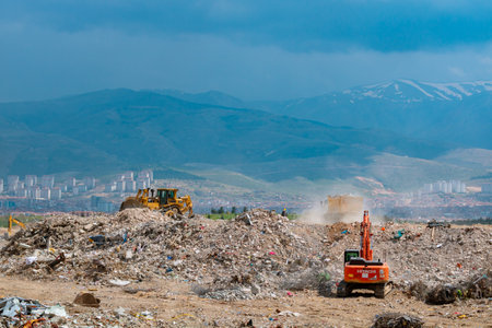 Rubble landfill area and excavators on working in Malatya after the major earthquakes. Malatya Turkiye - 4.24.2023のeditorial素材