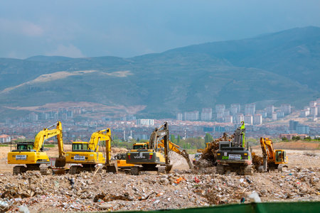 Excavators on the pile of rubbles in Malatya after the major earthquakes. Malatya Turkiye - 4.24.2023のeditorial素材