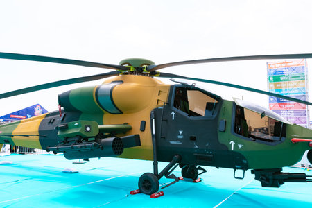 Atak or t129 combat helicopter with minigun on the platform in Teknofest 2023. Istanbul Turkiye - 5.1.2023のeditorial素材