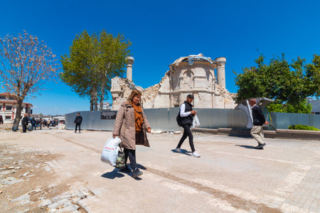 Local people and debris of Malatya Teze Cami or New Mosque on the background. February 6 earthquakes destruction. Malatya Turkiye - 4.25.2023のeditorial素材