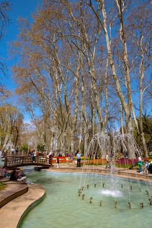 Gulhane Park view with pond and tourists or local people. Visit istanbul background vertical photo. Istanbul Turkiye - 4.14.2023のeditorial素材
