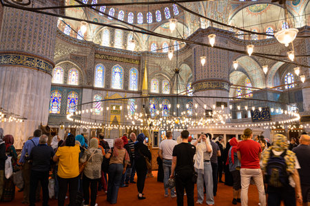 Visit istanbul. Tourists in the Sultan Ahmed Mosque or Blue Mosque. Istanbul Turkiye - 5.15.2023のeditorial素材